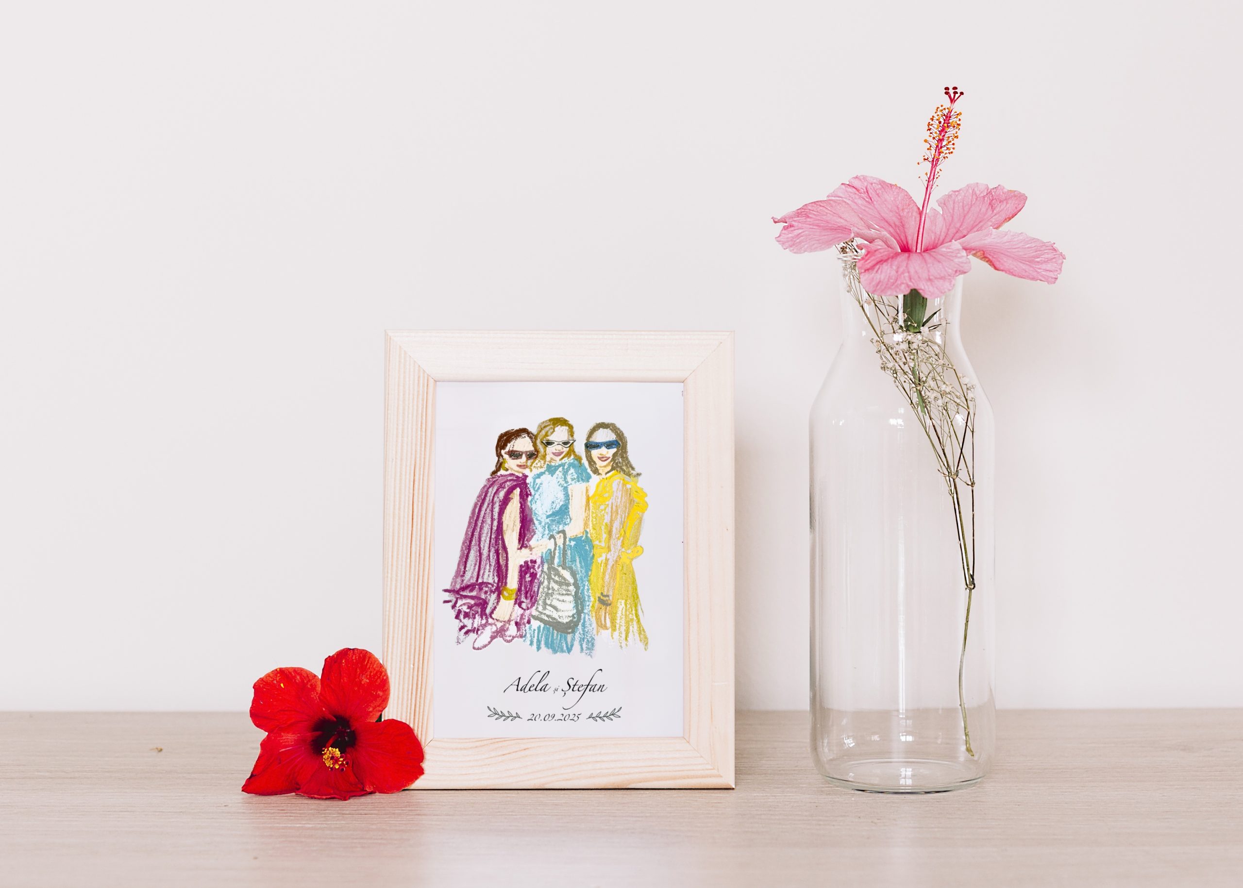 Finished illustrated portraits arranged on a table